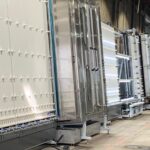 Automated vertical insulated glass production line with glass washer and lighted inspection station