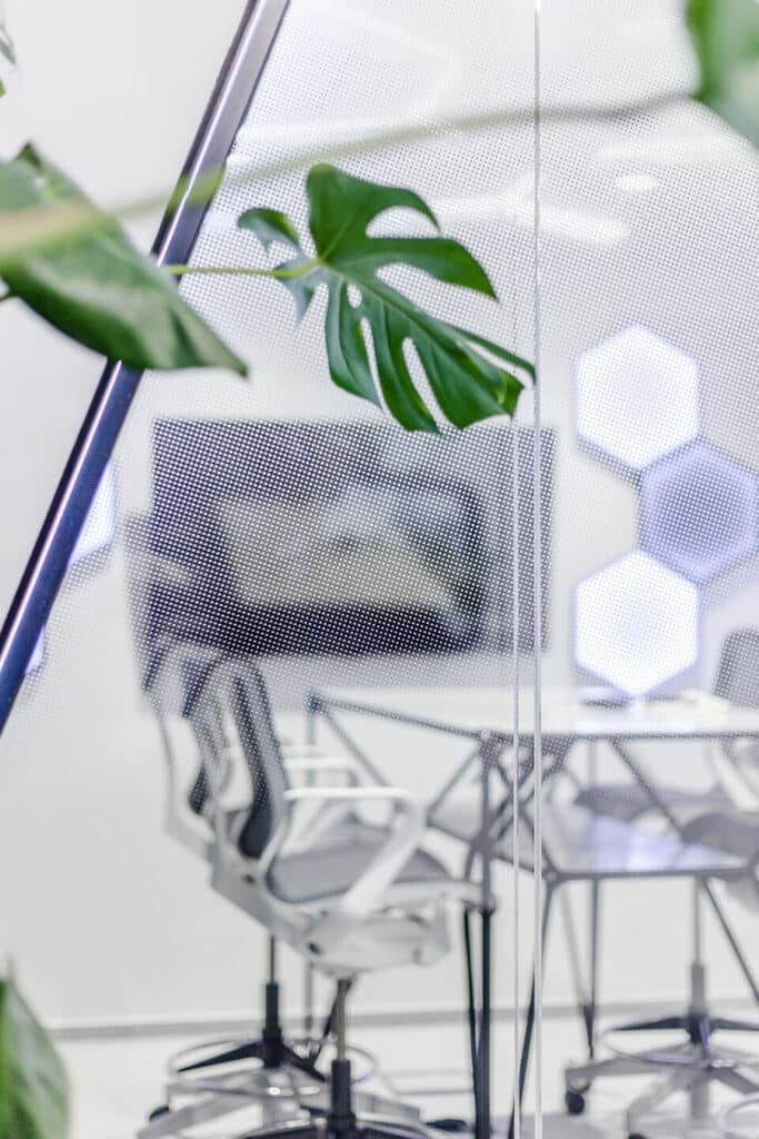 Meeting room seen through a micro-perforated AIR-board acoustic panel