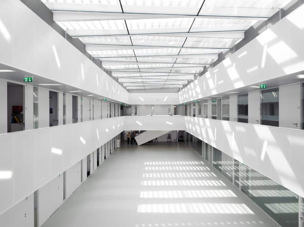 Translucent ceiling and wall panels in a large open atrium