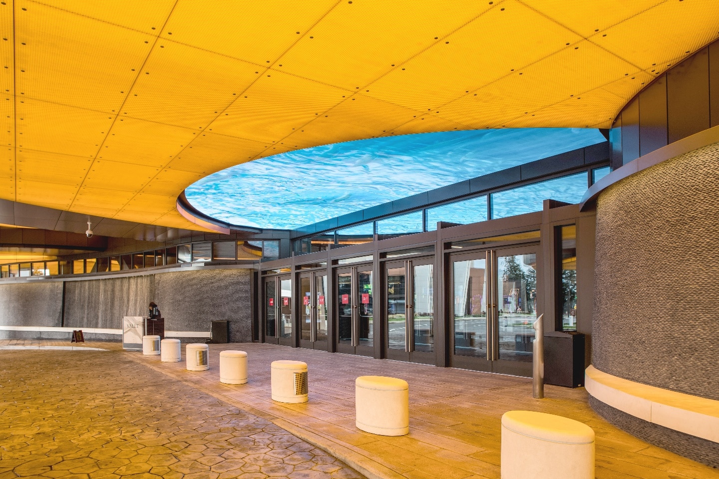 Illuminated translucent honeycomb panels adding warm light to a hospitality interior